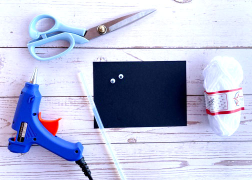 Distribute the materials to the students:  1 roll of white yarn 1 pair of googly eyes 1 scissors 1 pc pre-cut Cardstock paper  glue guns (to be shared)